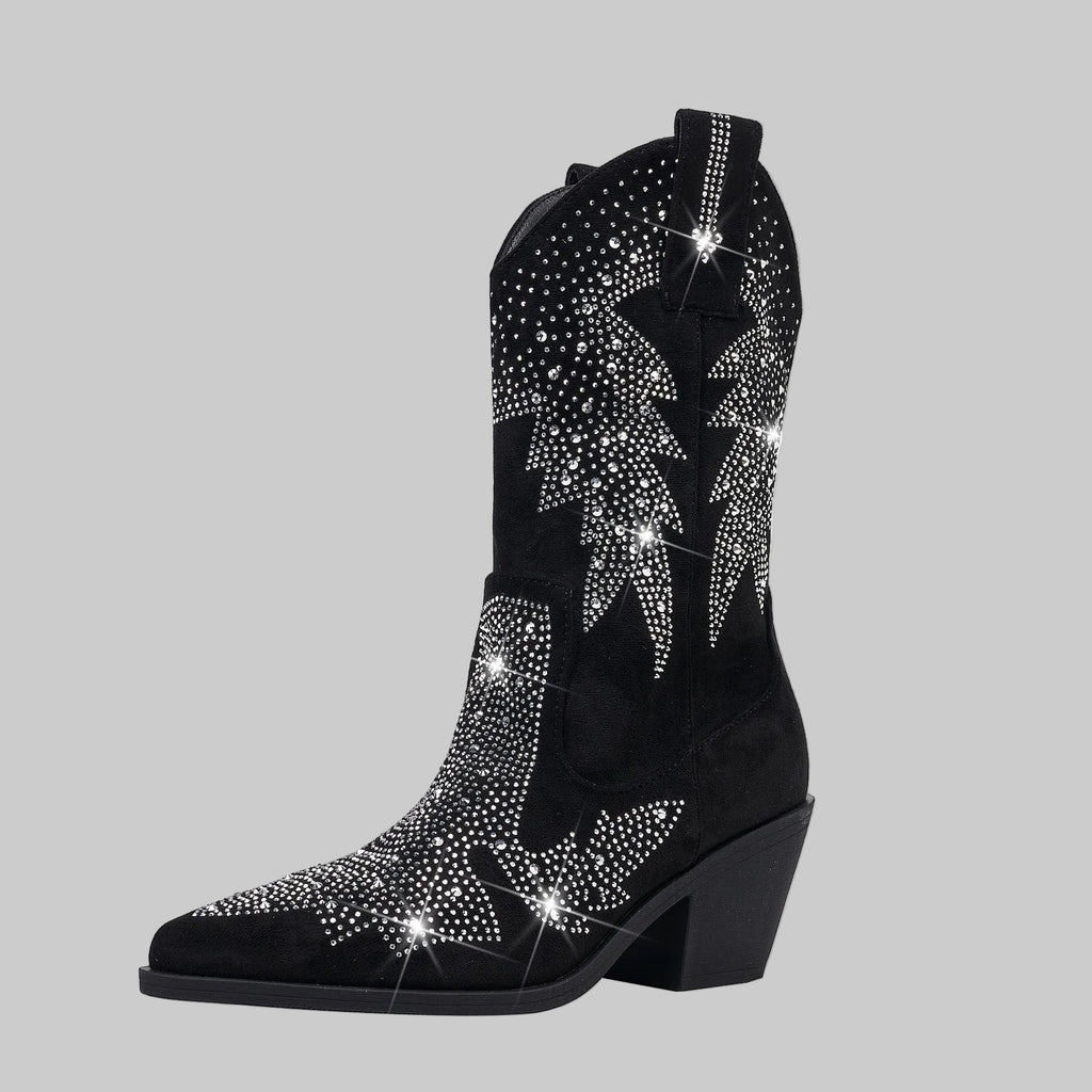 Black cowboy boot with silver rhinestone embellishments on a gray background